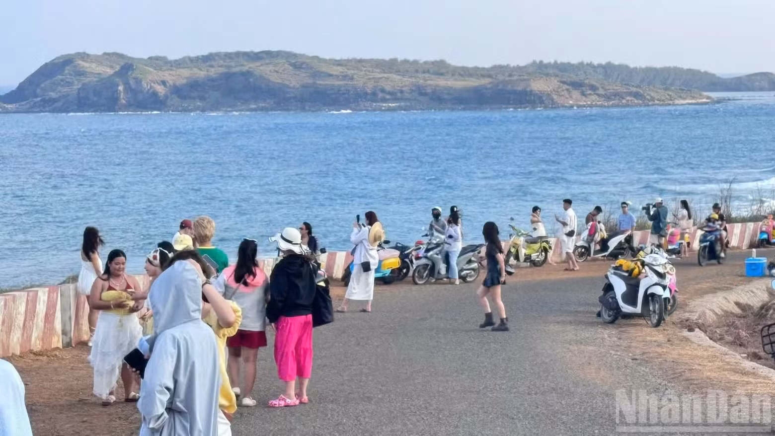 Visitors take photos on Phu Quy Island.