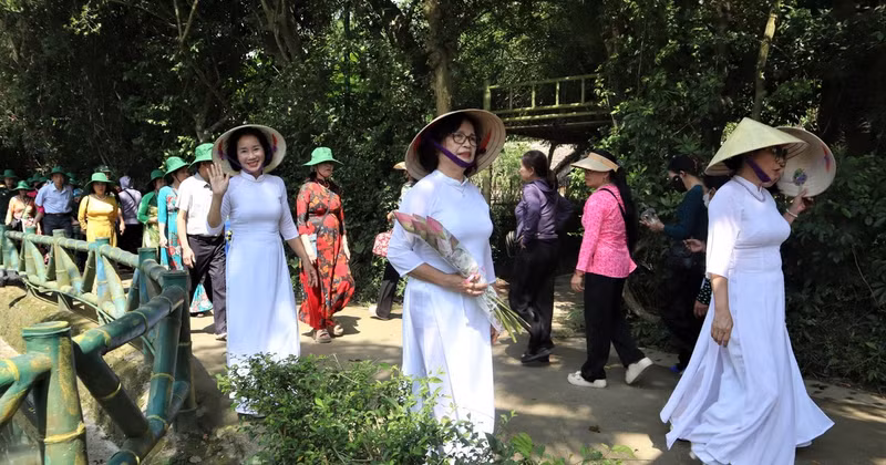 People respectfully offer lotus flowers and lilies to Him.