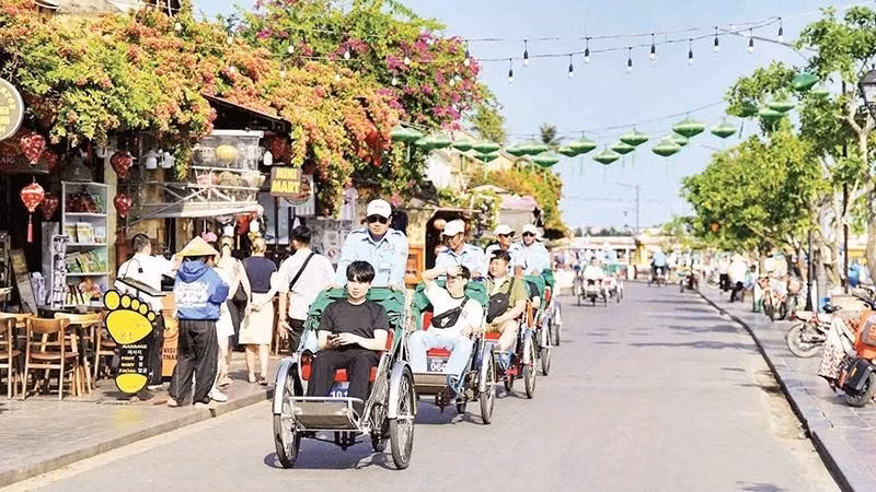 Tourists visit Hoi An ancient town, a world cultural heritage site.
