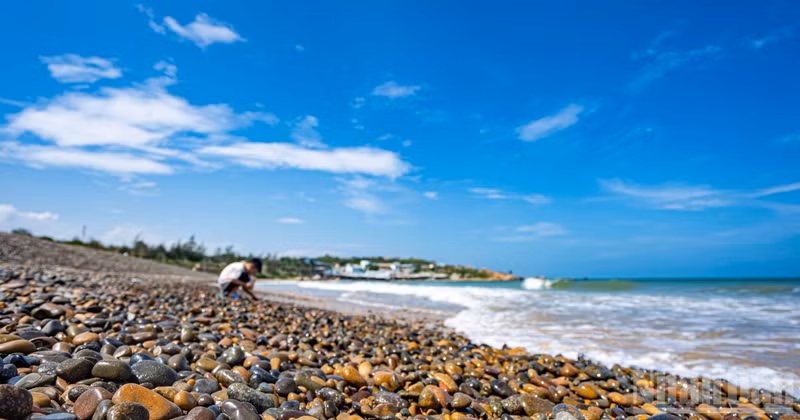 Co Thach Beach showcases a naturally occurring seven-coloured pebble shoreline.