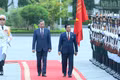 General Secretary and President To Lam and Myanmar President Min Aung Hlaing review the Guard of Honour of the Viet Nam People’s Army at the welcoming ceremony. (Photo: DANG KHOA)