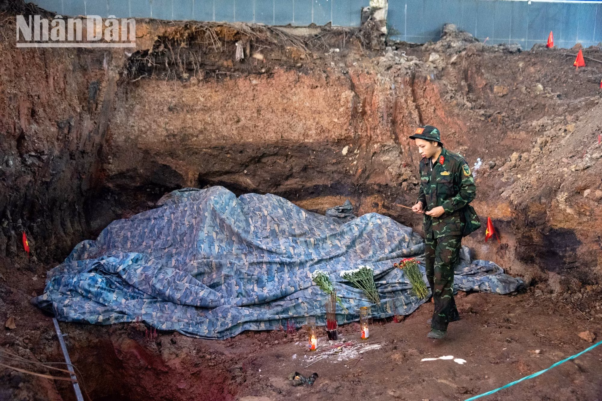 The soldiers struggle to contain their emotions when communal burial pits are uncovered.