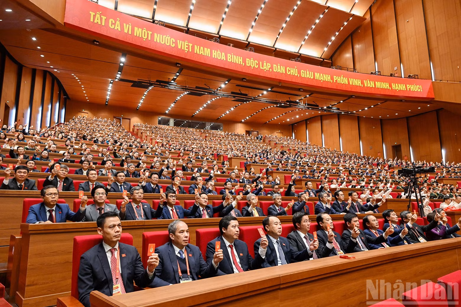 Delegates vote to adopt the Resolution of the 14th National Party Congress.