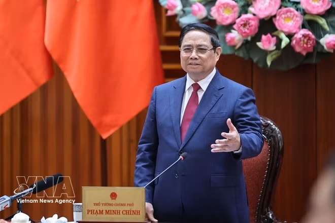 PM Pham Minh Chinh speaks at the meeting. (Photo: VNA)