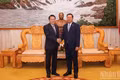 Vietnamese Minister of Public Security General Luong Tam Quang (left) and his Lao counterpart, Senior Lieutenant General Vanthong Kongmany, at their meeting in Vientiane on October 9, 2026 (Photo: DUY TOAN)