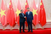 Vietnamese Prime Minister Pham Minh Chinh and General Secretary of the Communist Party of China Central Committee and President of China Xi Jinping at their meeting on August 31. (Photo: NDO)