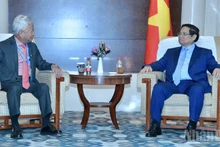 Prime Minister Pham Minh Chinh and AIIB President Jin Liqun at their meeting in Tianjin on August 31. (Photo: NDO) 