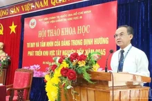 Associate Professor, Dr Nguyen Ngoc Hoa, Deputy Director of the Region III Academy of Politics, delivers the keynote speech at the workshop. (Photo: DINH TANG)