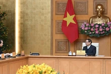 Prime Minister Pham Minh Chinh receives Chinese Ambassador to Viet Nam He Wei (Photo: Tran Hai)