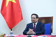 Vietnamese Prime Minister Pham Minh Chinh at the phone talks with his Algerian counterpart Sifi Ghrieb on March 18. (Photo: Tran Hai)