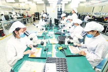 Manufacturing electronic boards at 4P Company in Hung Yen Province.