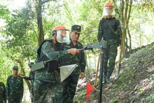 The Lung Lo Construction Corporation conducting mine and bomb clearance along the Viet Nam-China border.
