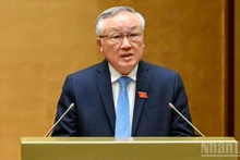 Permanent Deputy Prime Minister Nguyen Hoa Binh reports on the Government's performance during 2021–2026 at the 10th session of the 15th National Assembly on October 20, 2025. (Photo: Duy Linh)