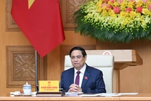 Prime Minister Pham Minh Chinh addresses the 14th meeting of the Central Council for Emulation and Commendation in Ha Noi on October 20 (Photo: Tran Hai)
