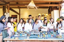 Visitors learn about wood carving at Driftwood Village.