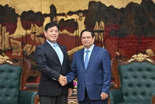 Prime Minister Pham Minh Chinh receives Yukihito Honda, CEO of the Sumitomo Corporation's Urban Infrastructure Development Group in Ha Noi on July 22 (Photo: Tran Hai)