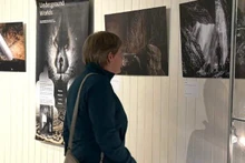 A visitor at the photo exhibition on the Phong Nha-Ke Bang caves.