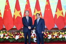 Prime Minister Pham Minh Chinh receives Zhao Leji, member of the Standing Committee of the Political Bureau of the Communist Party of China Central Committee and Chairman of the Standing Committee of the National People’s Congress of China, in Ha Noi on September 2. (Photo: NDO)