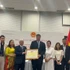 VFFCC President Do Van Chien presents a certificate of merit to the VKBIA collective. (Photo: VKBIA)