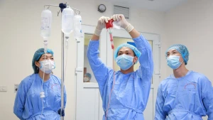 Doctors at the National Institute of Haematology and Blood Transfusion administer a stem cell transplant to a patient.