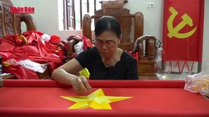 Video: Craft of “preserving spirit” of national flag 