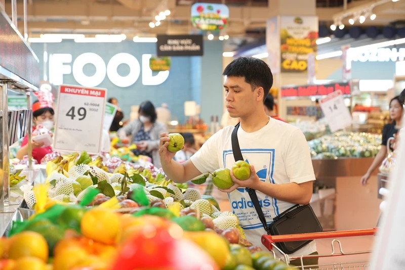 A man shop at Winmart Supermarket. (Photo: Bnews)