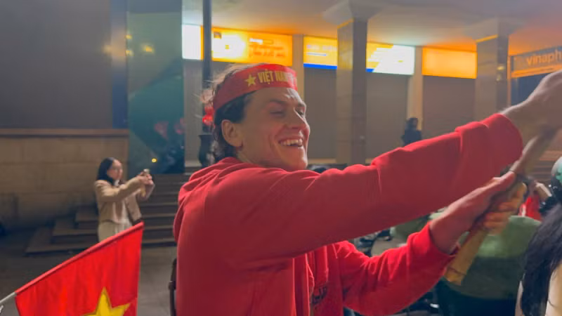 A foreign fan on the streets of Hanoi.