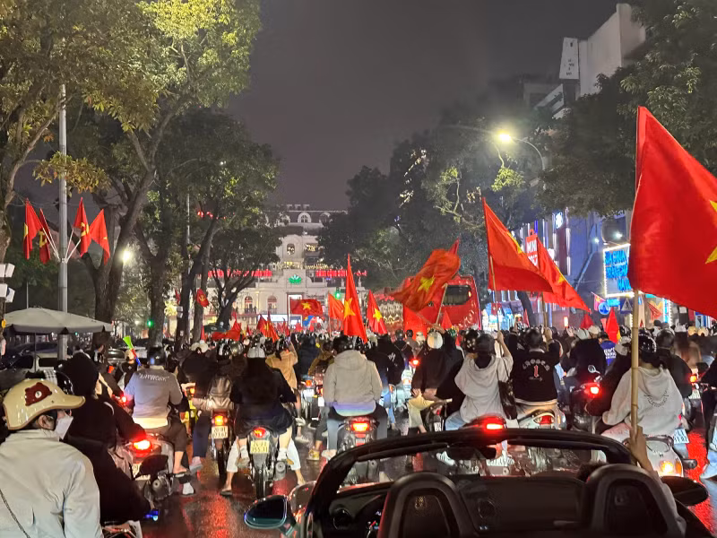 Although it was late at night, many central streets in Hanoi were still lined with flags.