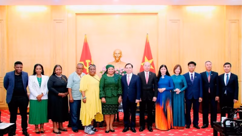 Delegates pose for a photo at the reception.
