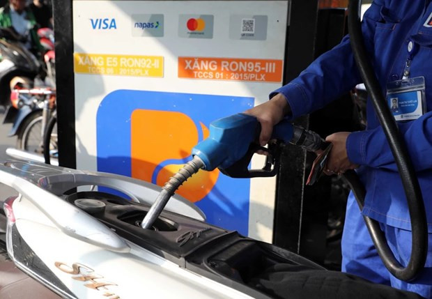 A motorbike is refilled at a gas station of Petrolimex. (Photo: VNA)