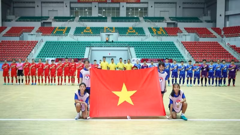 Teams perform the flag-raising ceremony before entering the first round of matches after the opening ceremony.