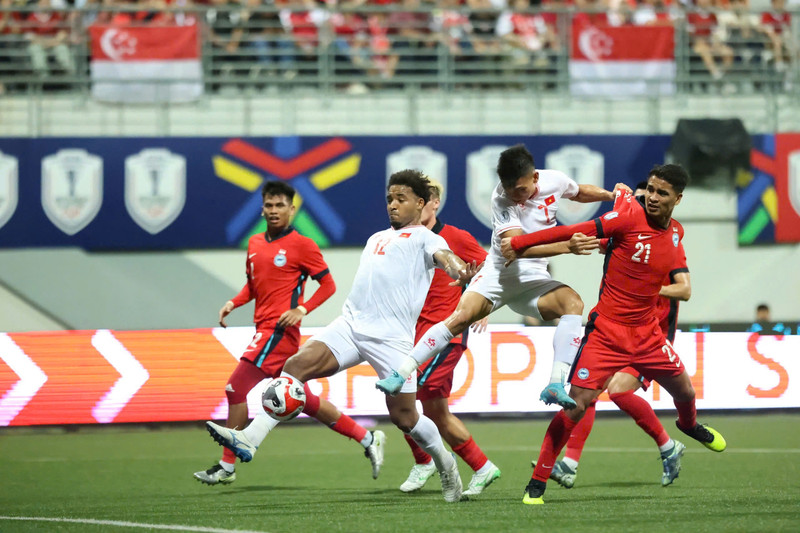 Forward Nguyen Xuan Son scores Vietnam’s second goal in their 2-0 win against Singapore in the ASEAN Cup 2024 semifinal first leg on December 26.