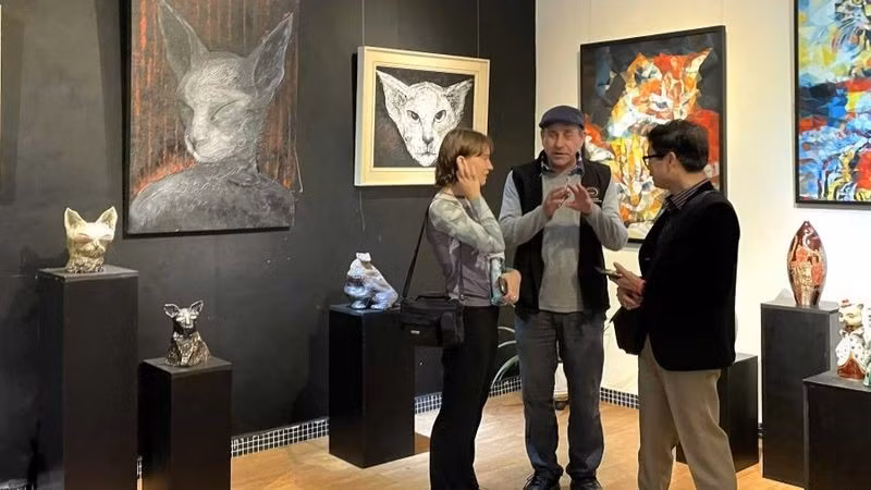 At an art exhibition in Hanoi