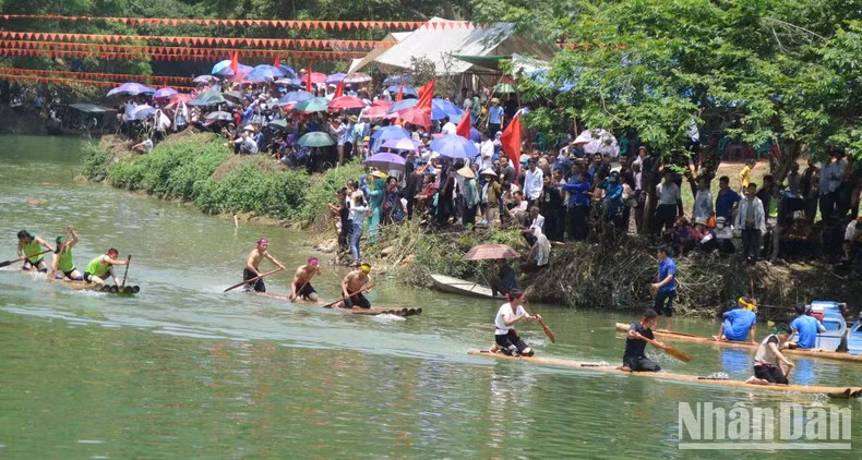 A boat race is held at the festival.