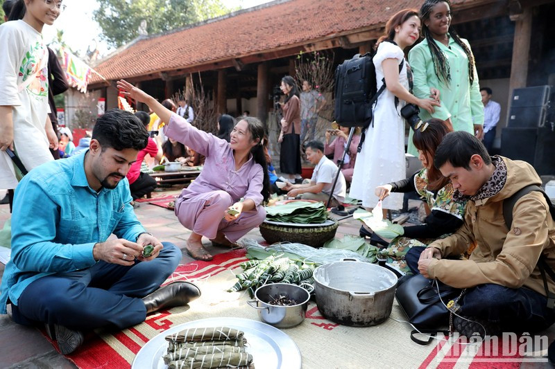 Jose Manuel Labrada Gonzalez from Cuba participates in most of the cultural experiences of the Vietnamese New Year.