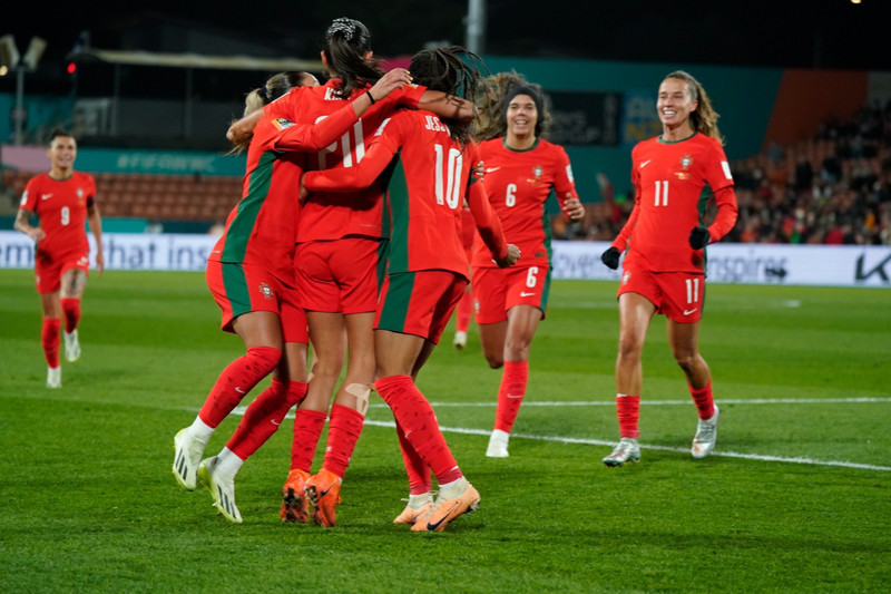 Portuguese players celebrate scoring a goal during the match.