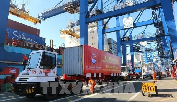 Containers being loaded at Tan Cang - Cat Lai Port in HCM City. (Photo: VNA)