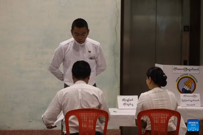 A voter checks in at a polling station in Yangon, Myanmar, Dec. 28, 2025. Myanmar kicked off its 2025 multi-party democratic general election with the first phase held on Sunday. The general election is scheduled to be held in three phases, with the second phase set for Jan. 11, 2026, followed by the third phase on Jan. 25. (Photo: Xinhua)