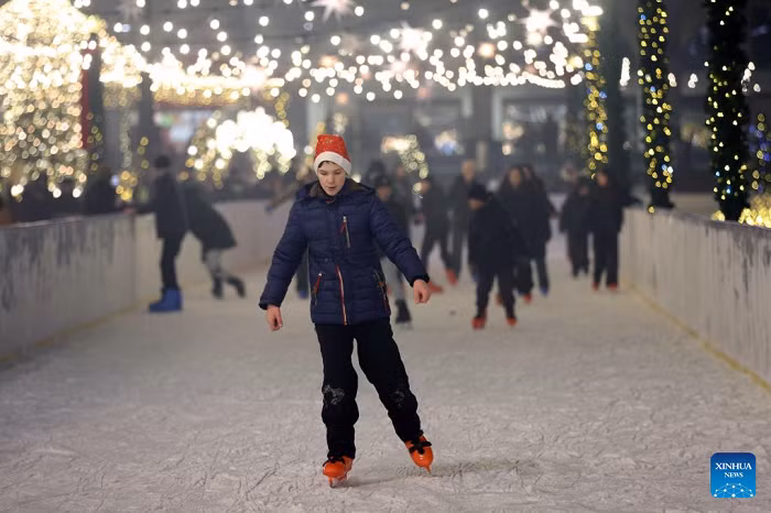 People skate at the Ala-Too Square during a New Year event in Bishkek, Kyrgyzstan, Dec. 23, 2025. (Photo: Xinhua)