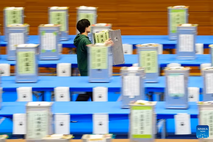 A staff member works at a counting station for the general election in Tokyo, Japan, Feb. 8, 2026. Japan's ruling coalition of Liberal Democratic Party (LDP) and its partner Japan Innovation Party is expected to secure a majority of seats in the House of Representatives in Sunday's general election, public broadcaster NHK said, citing its exit poll. (Photo: Xinhua)