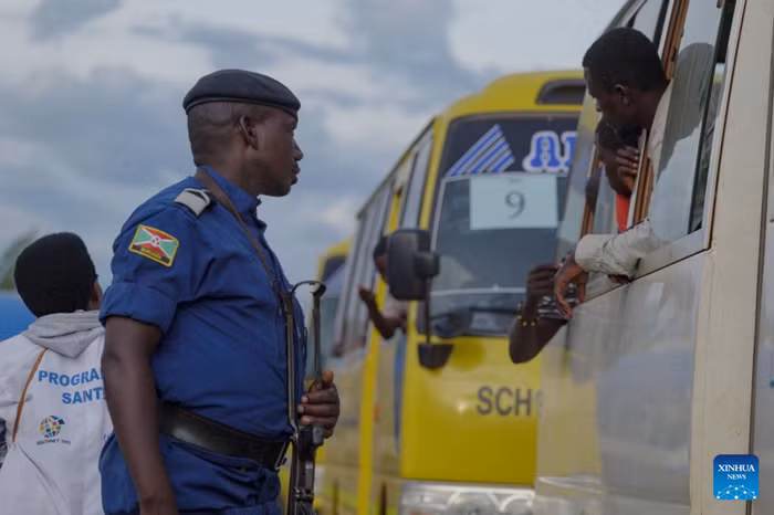 A Burundian solider stands guard at the Kavimvira border post between the Democratic Republic of the Congo (DRC) and Burundi near Uvira, DRC, on April 23, 2026. The first group of roughly 470 Congolese refugees in Burundi began returning voluntarily to eastern Democratic Republic of the Congo on Thursday, the United Nations refugee agency said. Nearly 20,000 Congolese refugees have already registered for the voluntary repatriation program, UNHCR said, adding that returnees will receive financial assistance and support to help them reintegrate. As of March 23, 2026, Burundi hosted about 109,000 Congolese refugees, including nearly 67,000 at the Busuma site alone, according to UNHCR. (Str/Xinhua)