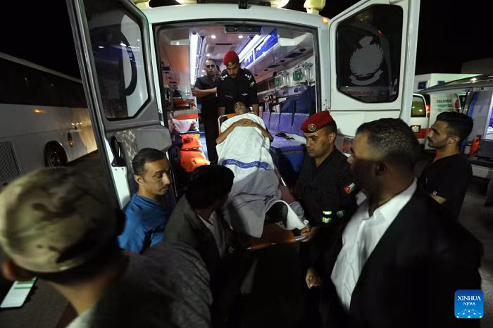 A sick child from Gaza arrives at the King Hussein Bridge border crossing, Jordan, on July 16, 2025. The Jordan Armed Forces on Wednesday evacuated the seventh group of sick children from the Gaza Strip under the Jordanian Medical Corridor initiative, according to a military statement. The group included 35 children, accompanied by 72 family members. They were transported to Jordan for treatment in local hospitals via the King Hussein Bridge. (Photo: Xinhua)