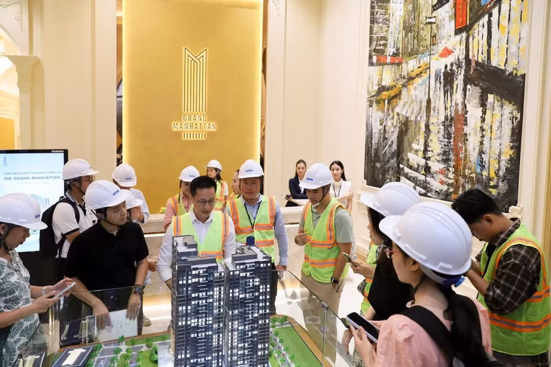 Prospective buyers explore a residential property development in the city centre.