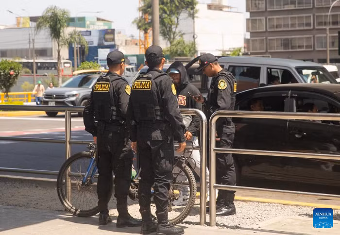 Police officers ask a pedestrian for identification near the La Cultura metro station in Lima, Peru, on Oct. 22, 2025. Peruvian President Jose Jeri declared on Tuesday a 30-day state of emergency for the capital Lima and the neighboring Callao region to tackle worsening public security. (Photo: Xinhua)