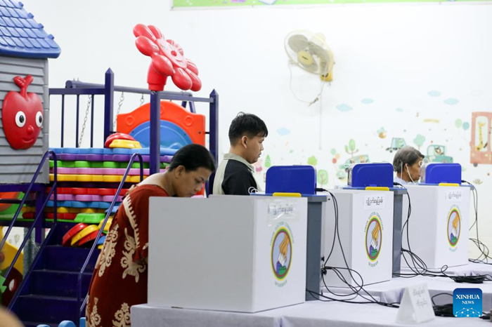 People vote at a polling station during the second phase of the general election in Yangon, Myanmar, Jan. 11, 2026. Myanmar kicked off the second phase of its multi-party democratic general election on Sunday morning, with polling stations opening across 100 townships. (Photo: Xinhua)