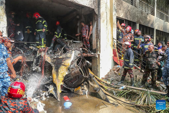 Firefighters work at the site of the crash in Dhaka, Bangladesh, on July 21, 2025. At least 19 people, mostly students, were killed as a training aircraft of the Bangladesh Air Force crashed on the campus of a college here on Monday. A government statement said that over 100 people were injured in the accident. Many of the injured are in critical condition. The Inter Service Public Relations (ISPR) of the Bangladesh Army said the training aircraft crashed at around 13:30 local time. (Photo: Xinhua) 
