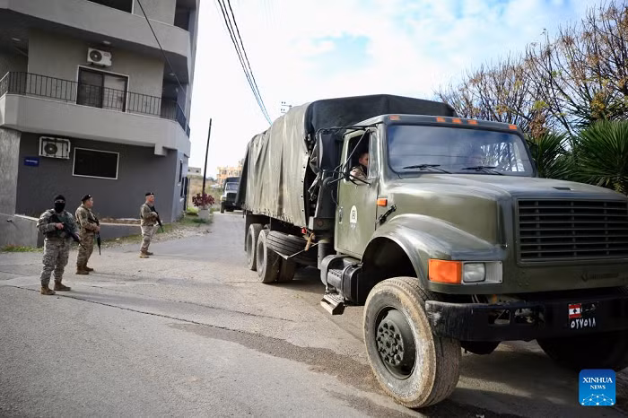 Soldiers from the Lebanese army guard trucks carrying weapons received from the Ain al-Hilweh Palestinian refugee camp in Sidon, Lebanon, Dec. 30, 2025. The Lebanese army on Tuesday received the fifth batch of weapons handed over from Palestinian refugee camps in Lebanon, as part of a state-led plan to centralize arms under national authority. (Photo: Xinhua)