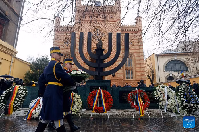 Soldiers attend a wreath-laying ceremony commemorating Holocaust victims at the Choral Temple on the occasion of International Holocaust Remembrance Day in Bucharest, Romania, on Jan. 26, 2026. January 27 is designated by the United Nations as International Holocaust Remembrance Day, a time to remember the six million Jews who perished in the Holocaust during the Second World War. (Photo: Xinhua)