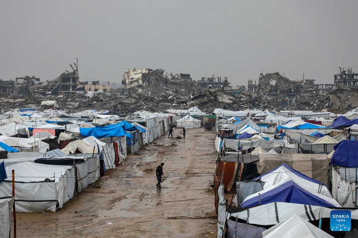 Photo taken on Dec. 11, 2025 shows shelters of displaced Palestinians in the Zeitoun neighborhood, southeast of Gaza City. Heavy winter rains and high winds are pounding flimsy temporary shelters of tents and tarps in the Gaza Strip, putting more vulnerable people at risk, UN humanitarians have said. (Photo: Xinhua)