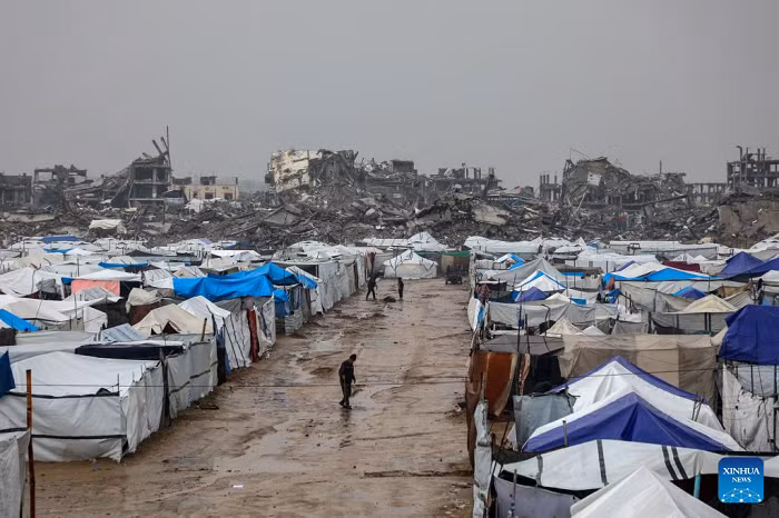 Photo taken on Dec. 11, 2025 shows shelters of displaced Palestinians in the Zeitoun neighborhood, southeast of Gaza City. Heavy winter rains and high winds are pounding flimsy temporary shelters of tents and tarps in the Gaza Strip, putting more vulnerable people at risk, UN humanitarians have said. (Photo: Xinhua)